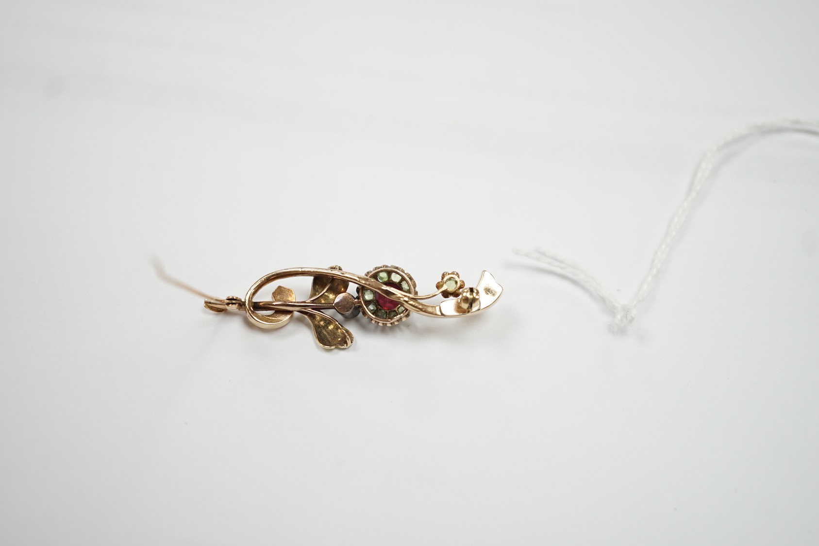 An early to mid 20th century Russian 56 zolotnik yellow metal, garnet? and split pearl set foliate brooch, 48mm, gross 4.3 grams.
